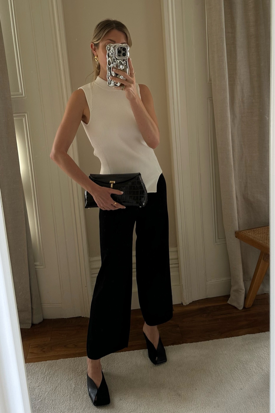 Black and white outfit, Toteme trousers, cropped trousers, Toteme clutch bag, Jil sander black heels, white knit asymmetrical top, classic outfit 

#LTKstyletip #LTKuk #LTKsummer
