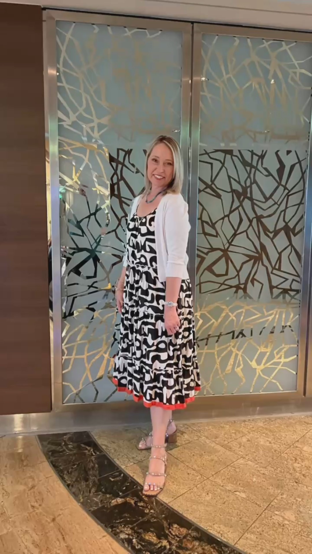 Chic and comfortable! The perfect summer midi dress. Love the black and white abstract print with the festive orange accent hemline trim! This dress is fully line with adjustable straps plus pockets  

#LTKSummerEdit #LTKTravel #LTKStyleTip