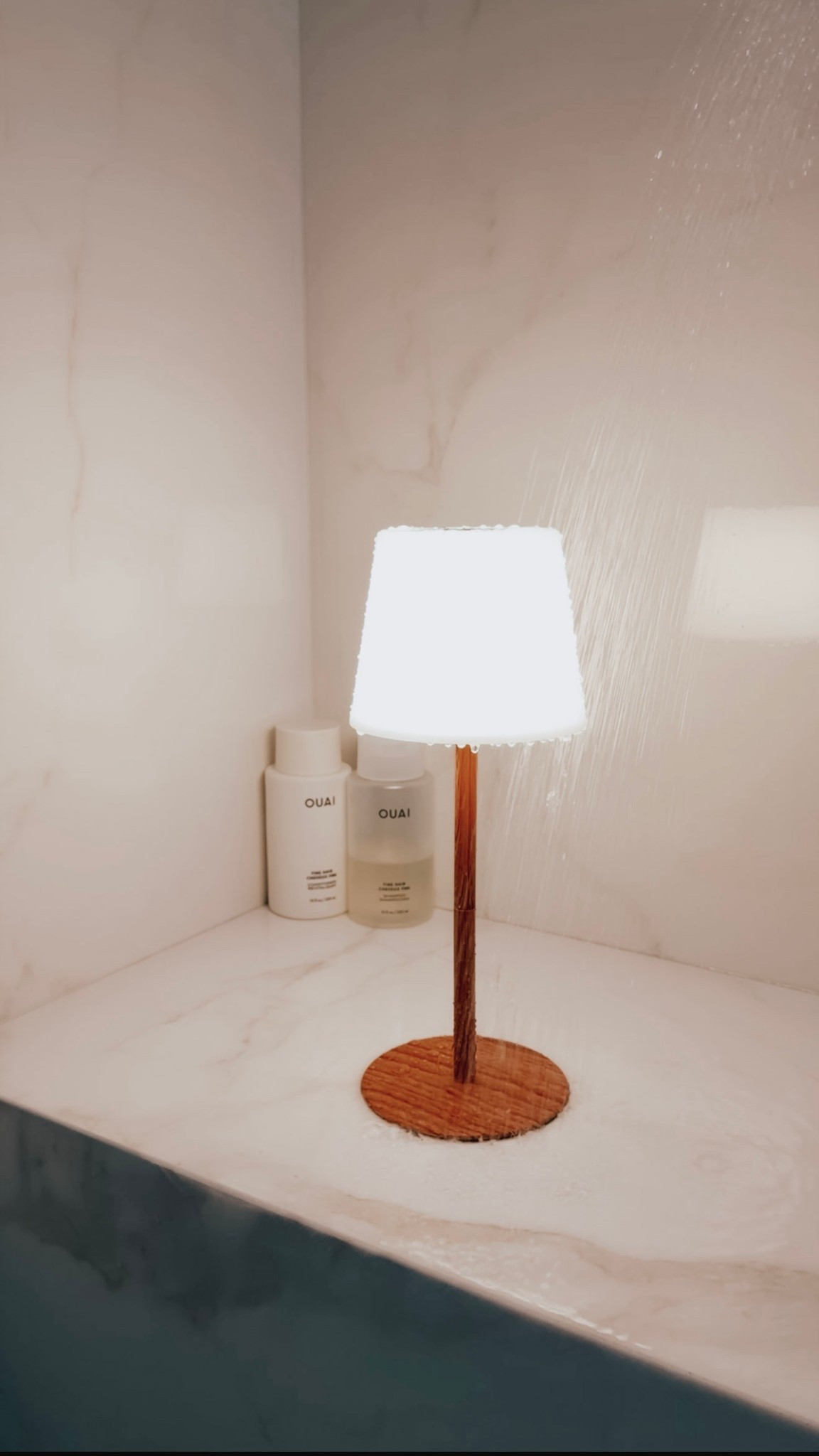Upgrade your bathroom with this sleek lamp and chic accessories. Perfect for a relaxing shower experience! 

#LTKHome
