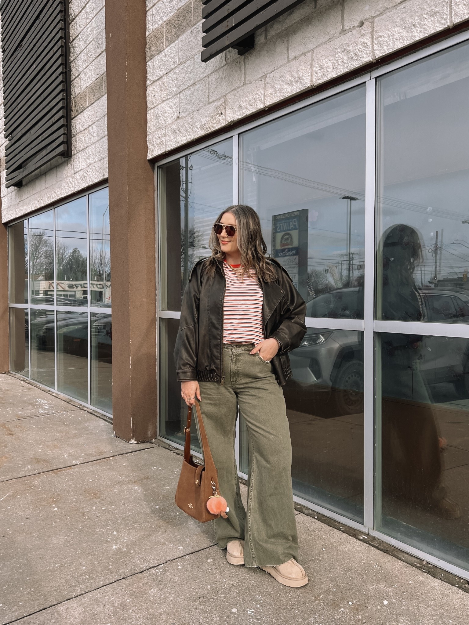Easy spring outfit! Wearing my usual size L in the leather jacket. Sized up to XL in the striped tee since I have a larger chest and didn’t want it tight. Wearing 32 long in the olive jeans (the long length was a bit too long for me, reg was too short, so I cut the hem for a custom length! Ugg Tazz platforms fit TTS. I wear this coach bag constantly, and the jellycat peach bag charm is so fun for spring!


#LTKmidsize #LTKjeans #LTKstyletip