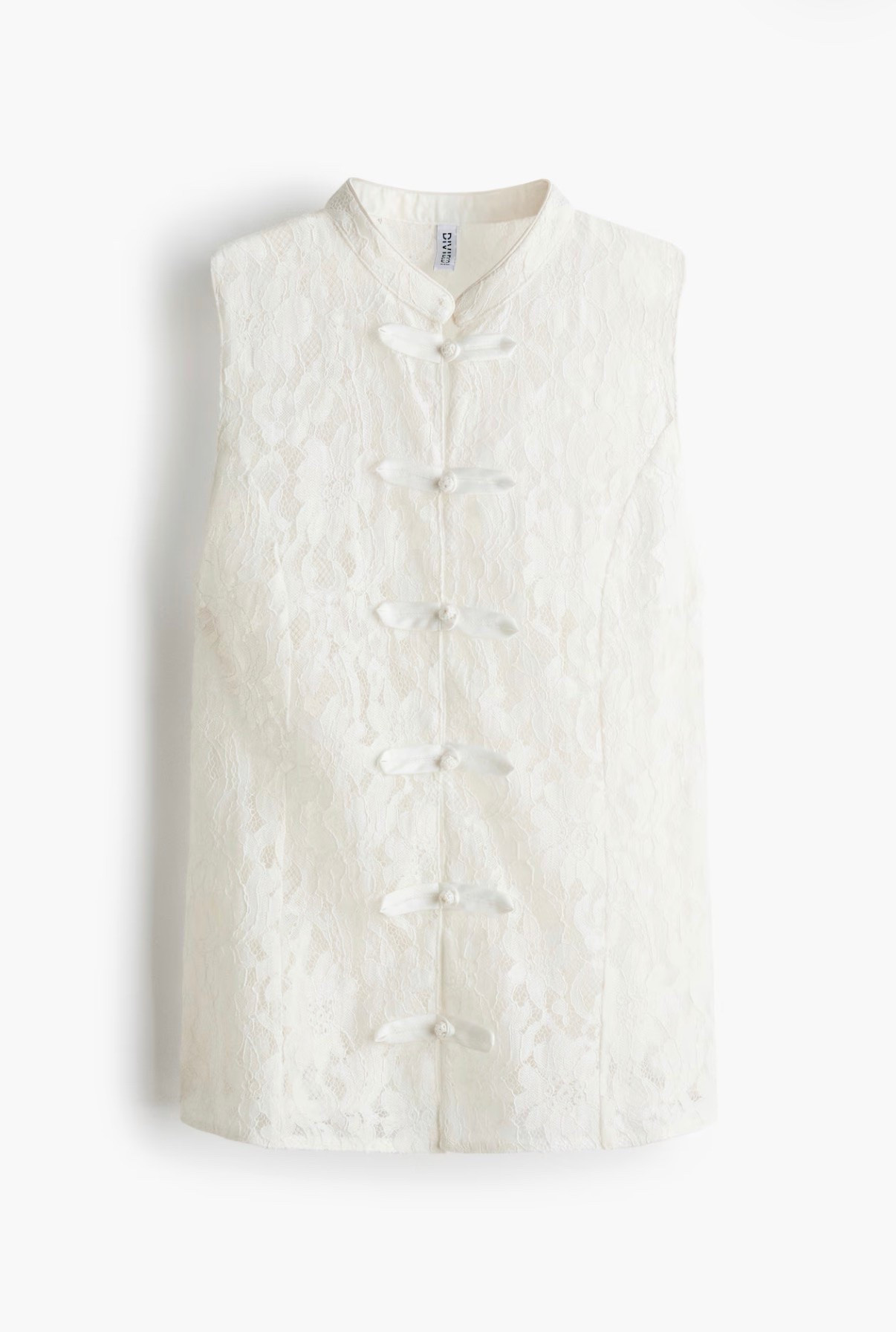 White lace vest top with frog closures

#LTKSeasonal