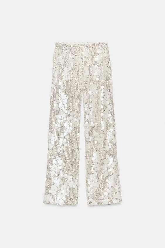 Model height: 181 cmMid-waist trousers with an adjustable drawstring waist. Featuring sequin appl... | Zara UK