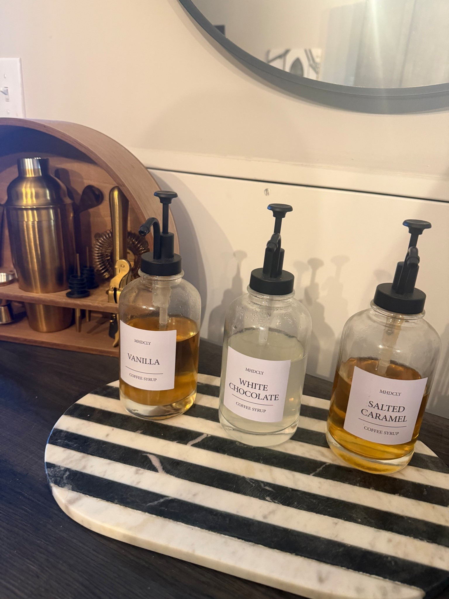 Creating my dream coffee bar with chic syrup bottles, modern bar tools, marble accents, and cozy home décor finds 🤎☕️ 

#LTKdayinmylife #LTKmorningroutine #LTKHome