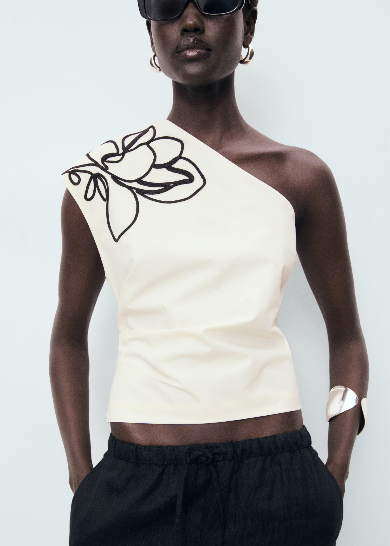 Asymmetrical flower-embroidered top - Women | MANGO United Kingdom | MANGO (UK)
