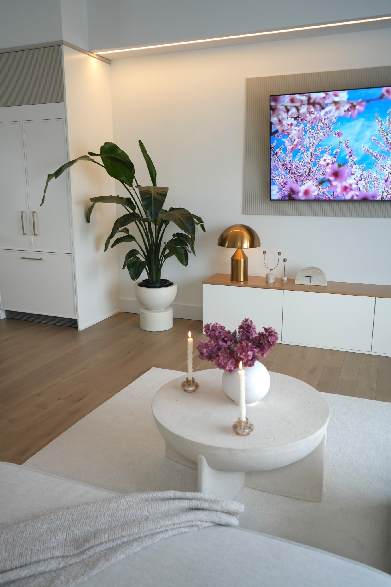 Living room inspo ✨ 

Round, textured coffee table, faux stems, lamp, planter , cozy neutral space 

#LTKSaleAlert #LTKHome #LTKstorytime