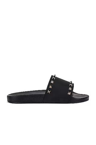 Valentino Garavani Rockstud Slide Sandals in Black | FWRD 