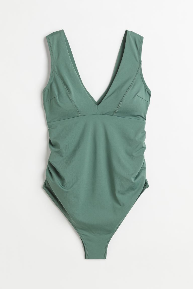 Conscious choice  Fully lined, V-neck swimsuit. Wide shoulder straps crossed at back, silicone tr... | H&M (US + CA)