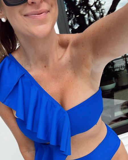 In a medium one shoulder ruffle blue bikini, sunglasses and accessories for pool / beach summer day from amazon- fits TTS.

#LTKswim #LTKunder50 #LTKstyletip