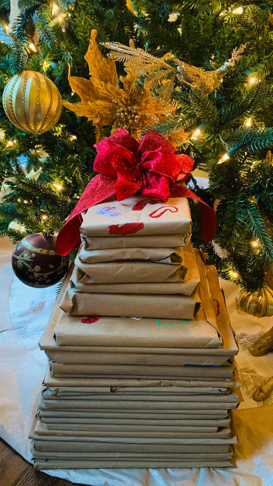 Start your Christmas 🎄 book advent now, so December isn't one more thing on your list. 📚

Brown paper bags from Whole Foods, cut open and wrapped around the books. Then dip cookie cutters in paint (an egg carton works as your paint tray) and stamp snowflakes and trees all over the paper. Kids can do the stamping, and it doesn't have to look perfect.

What makes it calm is starting in September. Pick up a few books at a time now, and you won't be wrapping a whole pile at 10pm on November 30th.

Every book is listed on the blog with links, so you can start collecting early.

#LTKdayinmylife #LTKKids #LTKSeasonal