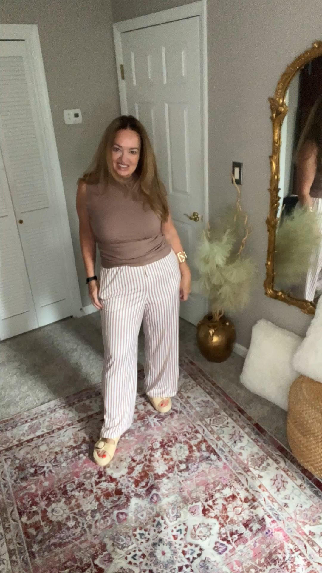 Easy elevated travel set featuring striped pants with drawstring waist and pockets and a solid mock neck sleeveless top with side ruching. Available in many color combos.

#LTKTravel #LTKootd #LTKActive