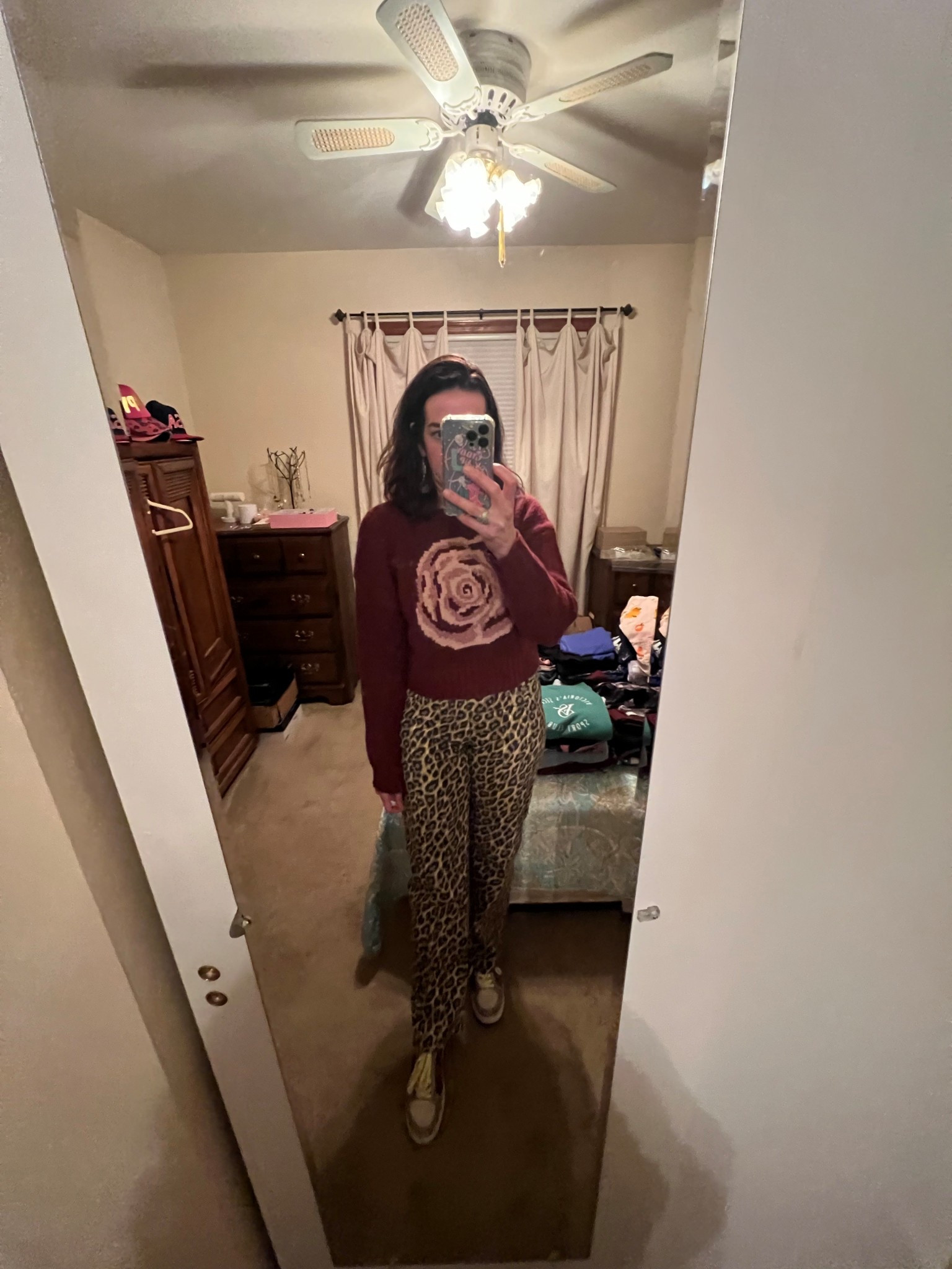 Burgundy rose cropped sweater (xs). Mid rise leopard jeans (27). Multicolor leopard sneakers (8.5). #sweater #burgundysweater #rosesweater #leopardjeans #midriseleopardjeans #sneakers #leopardsneakers #multicolorsneakers #springoutfit 
spring outfits 2026 

#LTKSeasonal #LTKootd