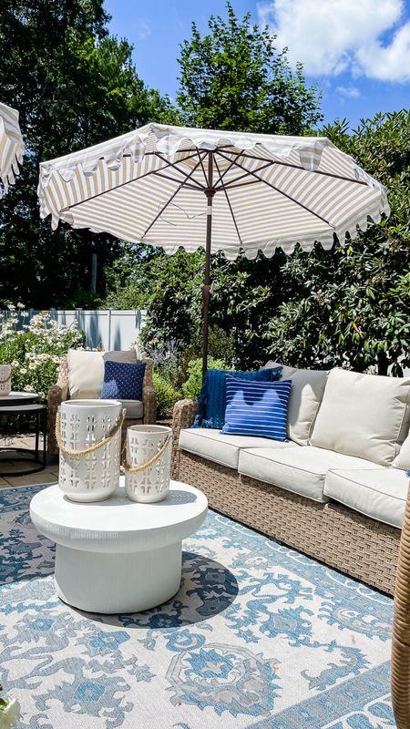 Outdoor patio seating from Walmart, striped umbrella, outdoor area rug, ceramic candleholders, decorative pillows, outdoor table and more coastal style home decor

#LTKSeasonal #LTKFamily