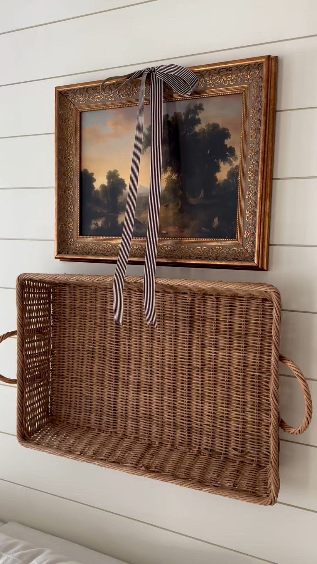 We updated the wall behind our living room couch with a basket and framed art.

#LTKHome #LTKFindsUnder50