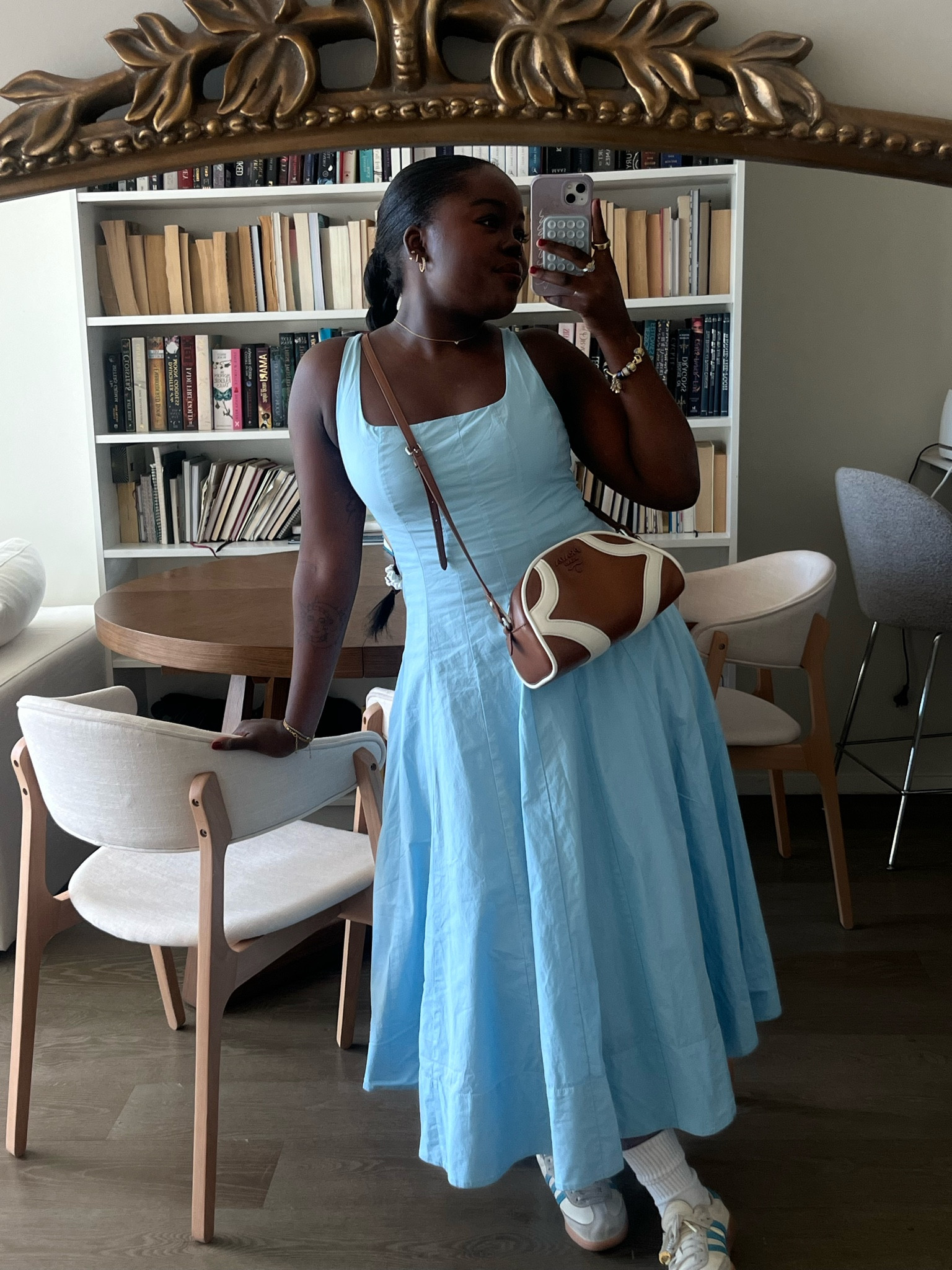 The fit of this dress is so flattering to dress up or down! I’d recommend sizing down! 