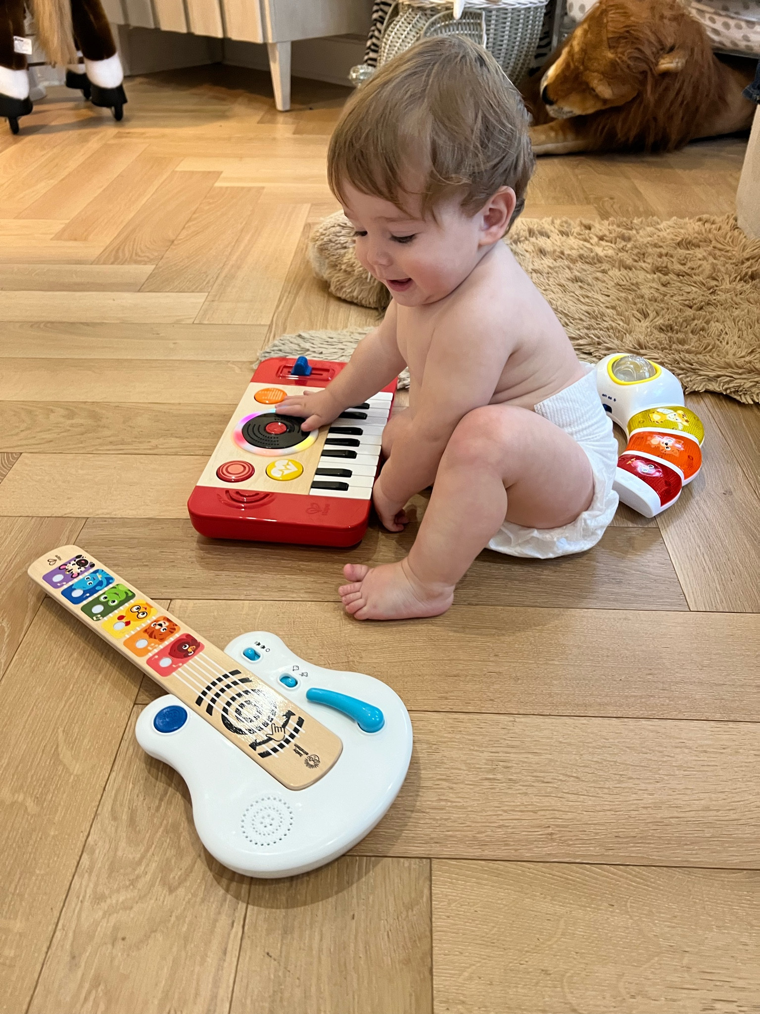 Gift ideas for Baby! We just hosted a music themed first birthday party for Beau and this baby dj set and toddler dj set and baby guitar and toddler guitar are great ideas. Also linked the giant lion stuffed animal in the back that’s perfect for a safari themed nursery. 

Toddler gift ideas, baby gift ideas, baby music instruments 