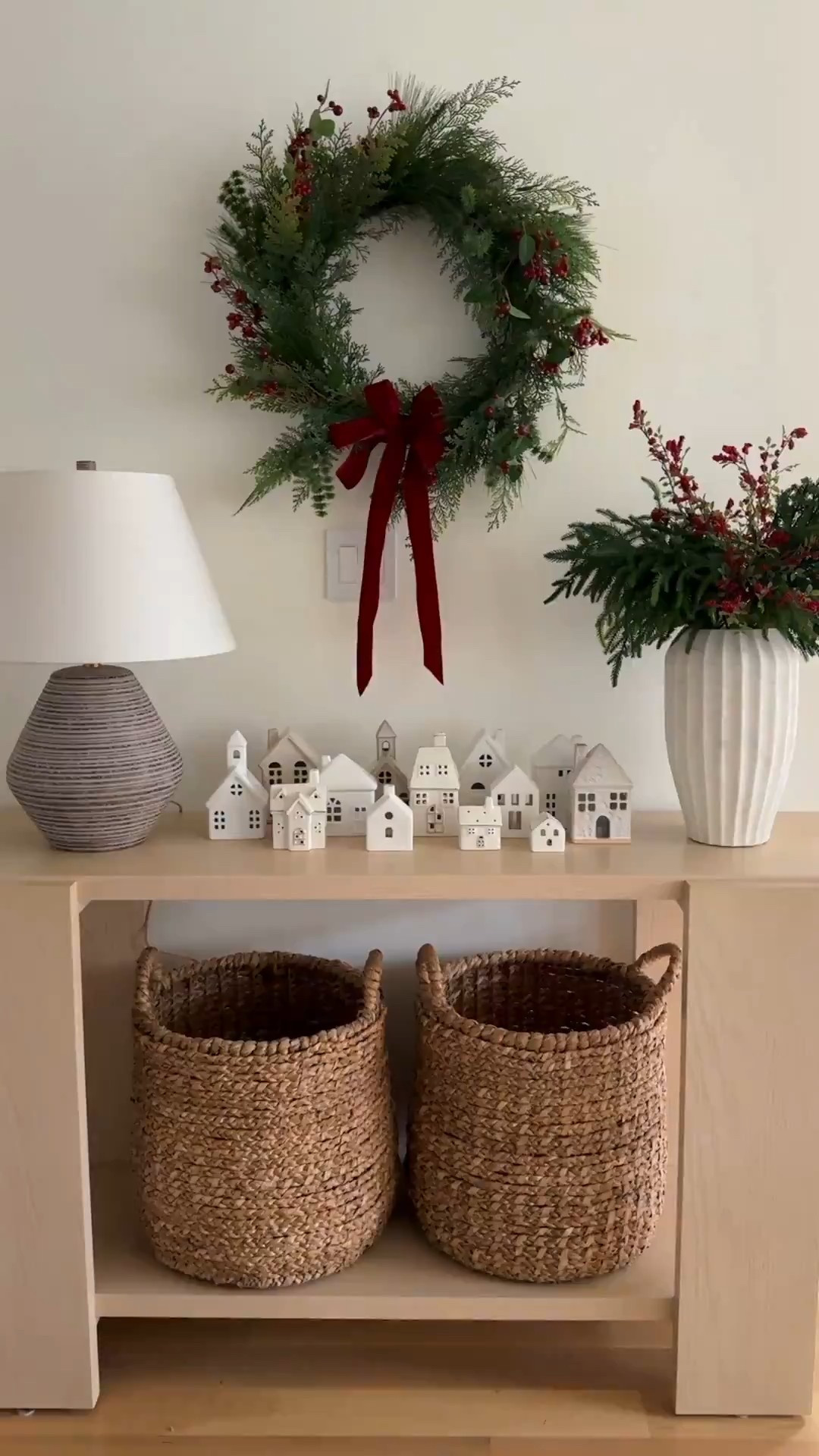 Hang the wreath inside so you can admire it! Styled the Christmas village houses that I’ve been collecting on my console table. Hidden in my woven baskets is dirty laundry and toys! Shhhh

#LTKHome #LTKmomlife #LTKHoliday