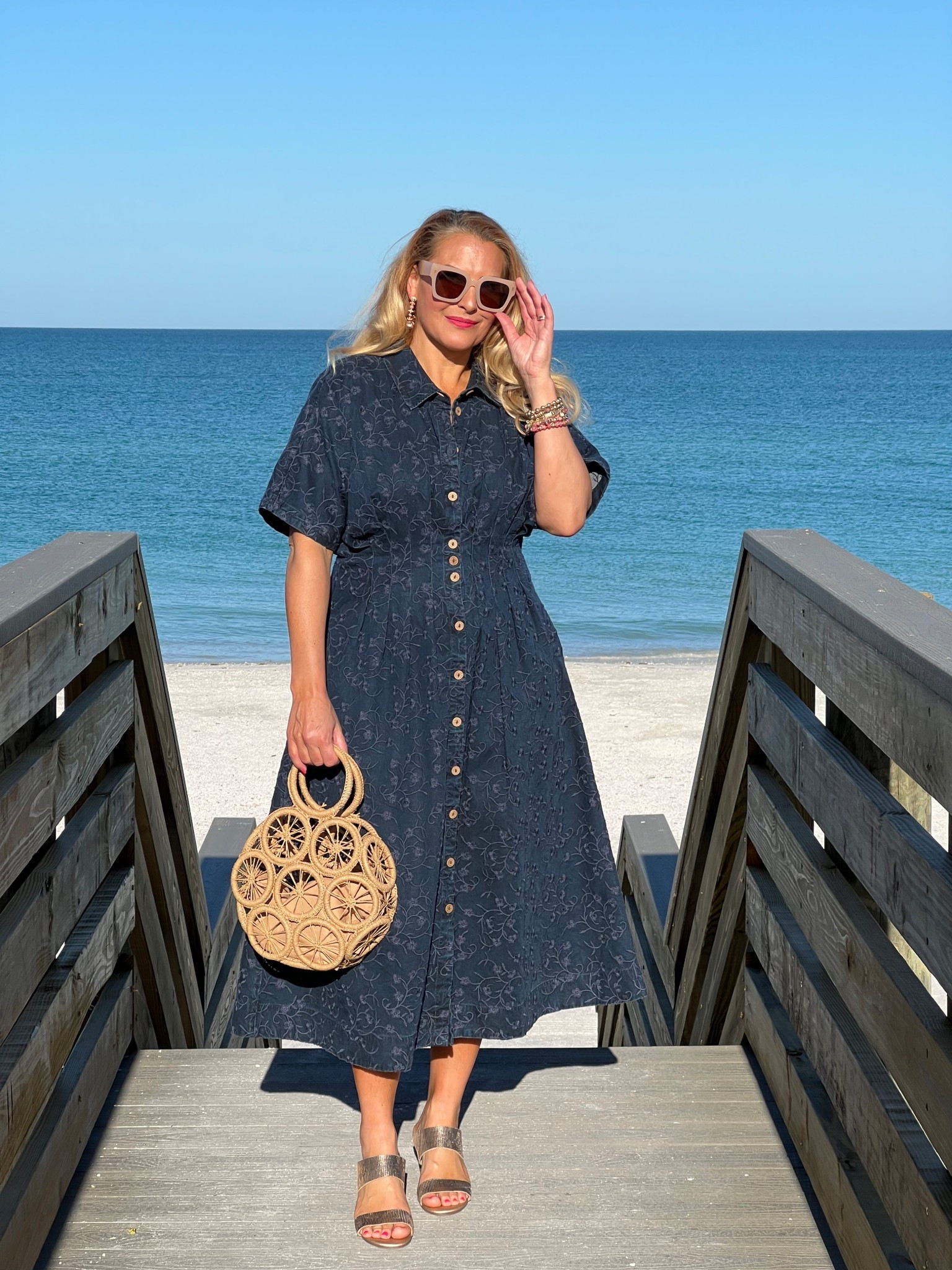 🏝️SOFT SURROUNDINGS: #ad Packing for a beach getaway? Here’s the dress you need! @soft_surroundings #softsurroundings

👗My embroidered short sleeve midi dress flatterers with front and back tucks that define your waist. Love the tonal embroidery and beautiful floral pattern. You can wear this meeting friends for a lunch date, a beach getaway or everyday wear. Effortless style + versatility + breathable fabric = The dress you need!

🫶🏻Truly looks like a sophisticated denim dress. Buttons down the front, has side pockets and so soft! I’m wearing a medium and it fits true to size. Available in XS-3X. Color: Embroidered medium wash.

👒When heading out to the beach, don’t forget to pick up my Catalina Cowboy hat! This raffia hat features a colorful braided faux suede hatband and has an interior adjustable sweatband that makes it comfy. Also love the shapeable three inch brim to offer extra sun protection. 

🙌🏼In addition to my hat, I’m wearing a set of five bracelets with matching earrings. The genuine rhodonite beads in pinks, golds and earth tones look fantastic for spring and summer.

👡You can’t forget about these insanely comfortable textured sandals. Obsessed! This golden leather sandal has a soft shimmer and glow. Elevated and chic. You’ll be reaching for these all spring and summer long. I walked around all day and my feet felt great. Order your normal size. These are fantastic!

👉🏼Follow my shop @jtstjtst11 on the @shop.LTK app to shop this post and get my exclusive app-only content!

#liketkit 
@shop.ltk

#LTKSeasonal #LTKOver40 #LTKSaleAlert #LTKU #LTKTravel #LTKgrwm #LTKootd #LTKMidsize #LTKSwim #LTKFestival