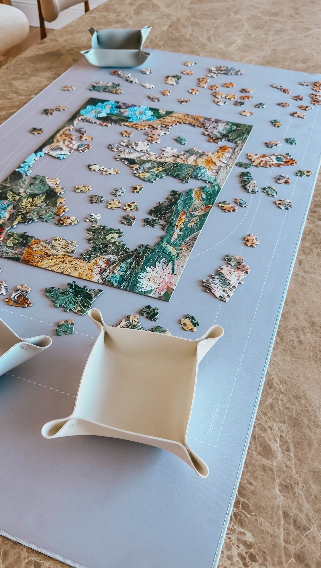 A puzzle mat is designed to turn a sprawling, in-progress puzzle into something you can pause, protect, and tuck away without losing your place. You can spread out a puzzle across a dining table, work on it for a while, then roll it up and reclaim your space, knowing that when you unroll it later, everything will be just where you left it, like time briefly paused. A puzzle lover’s must have! 

 #LTKHome