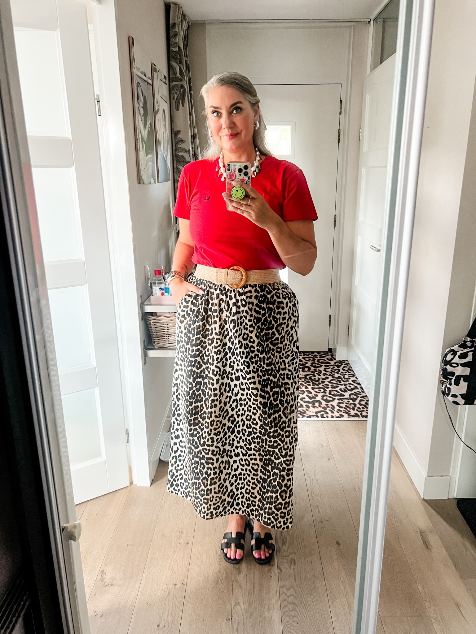 Ootd - Thursday.  Red Fred Perry t-shirt (thrifted, M) paired with a cotton leopard skirt (Shoeby), black leather sandals (old) and a neutral woven belt. A black belt would have been better but I am only seeing that now. Pearl charm necklace  

#LTKeurope #LTKnederlands #LTKsummer