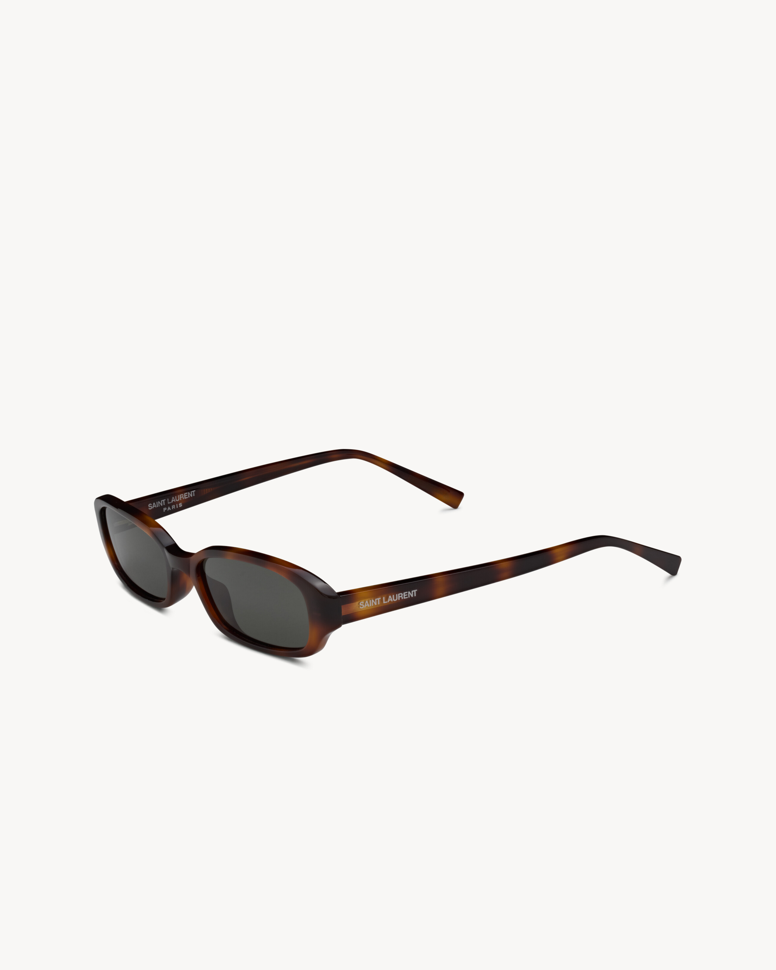 tortoiseshell oval sunglasses with elongated acetate frames and nylon lenses. | Saint Laurent Inc. (Global)