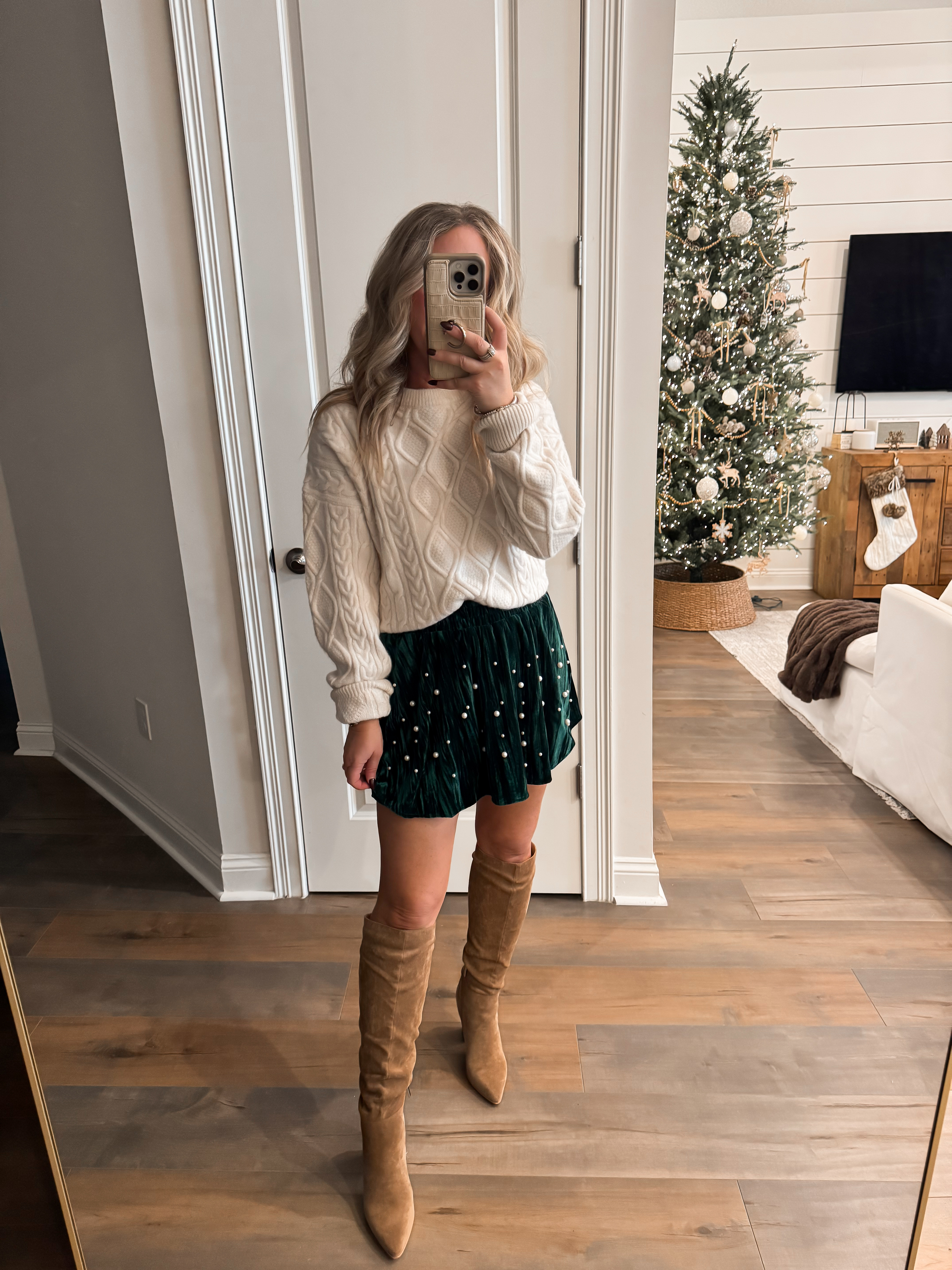 Amazon holiday outfit inspo ✨ Christmas, holiday party, event look, winter fashion, affordable women's fashion finds. White cable knit trending sweater, green velvet skort with pearl detail, knee high boots. Wearing a size S in both. 

 #LTKHoliday #LTKootd #LTKFindsUnder50