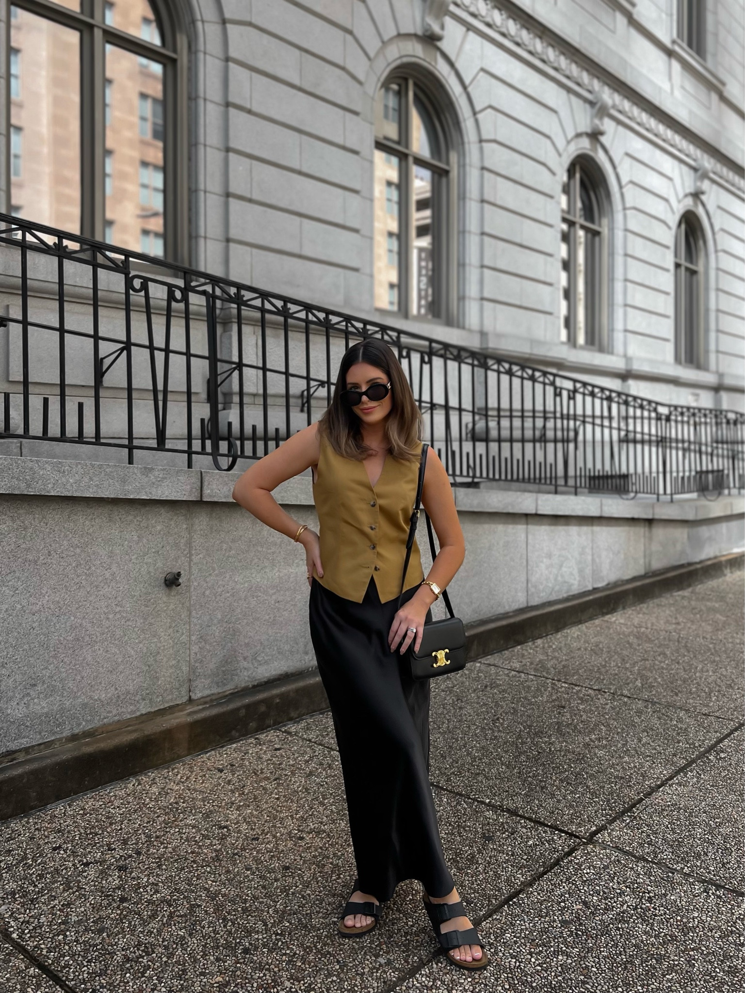 Black satin skirt styled with a vest and Birkenstocks 

#LTKSeasonal #LTKunder100 #LTKshoecrush