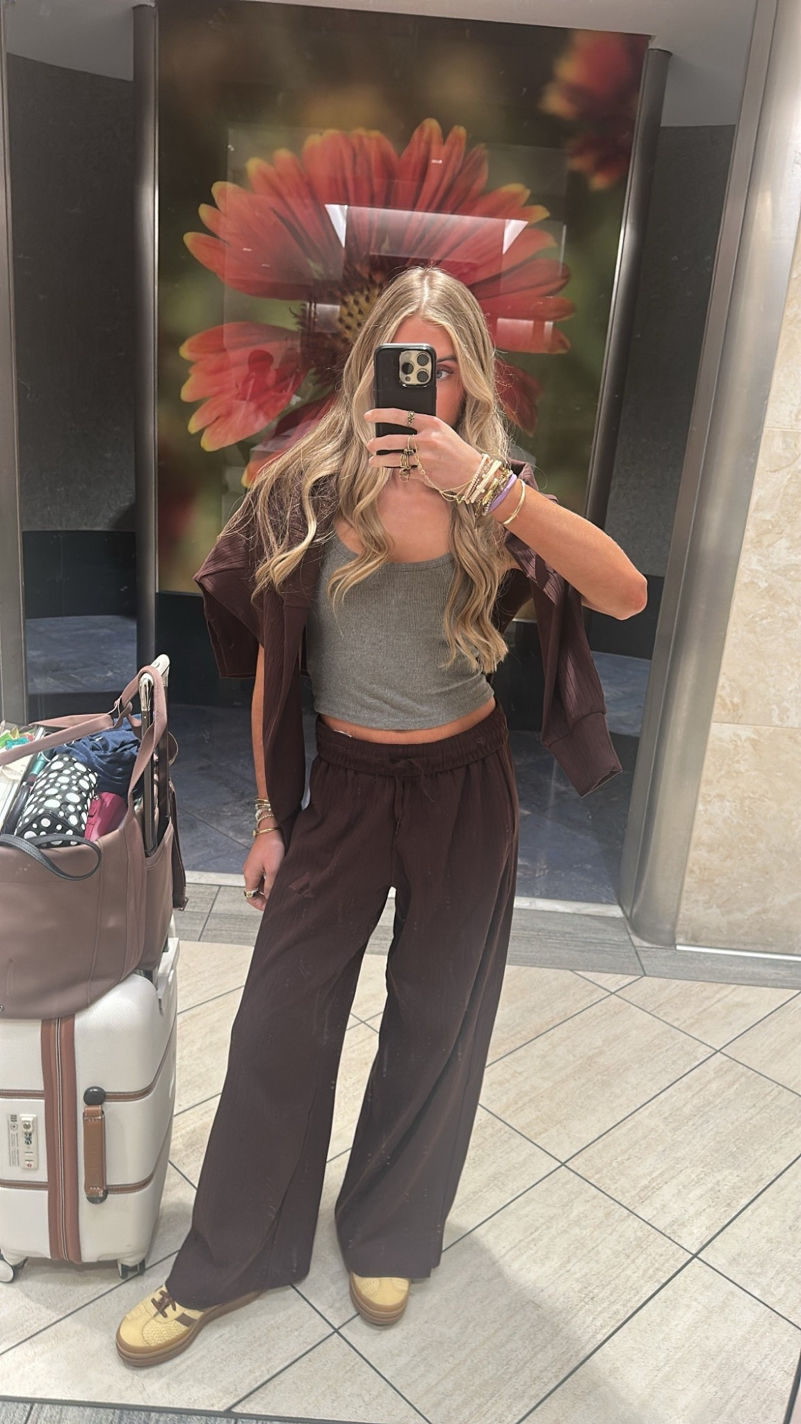 My travel outfit. I’m wearing my go to old navy tank top with the adidas two piece matching ribbed brown set  

#LTKSaleAlert #LTKTravel #LTKootd