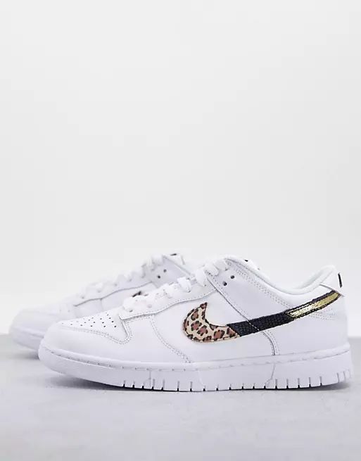 Nike Dunk Low trainers in white with leopard print swoosh | ASOS | ASOS (Global)