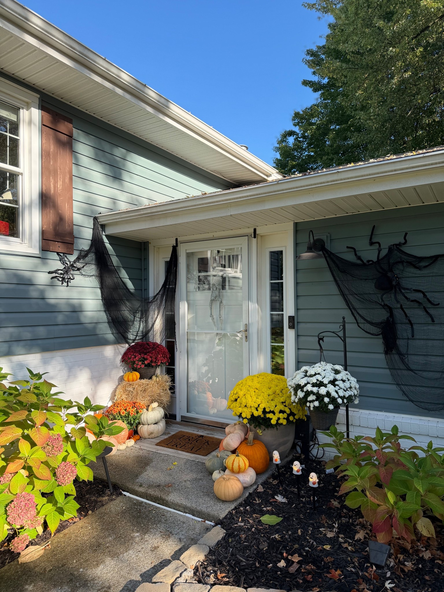 Updated porch! Alex added the gorgeous yellow mums and some more Halloween decor!!! Had questions on the little ghost lights next to the porch — sooo cute for the kids!! 😍👻

Halloween porch, Halloween decor, spider webs, spiders, ghost lights, Walmart finds 

#LTKHome #LTKHalloween #LTKSeasonal