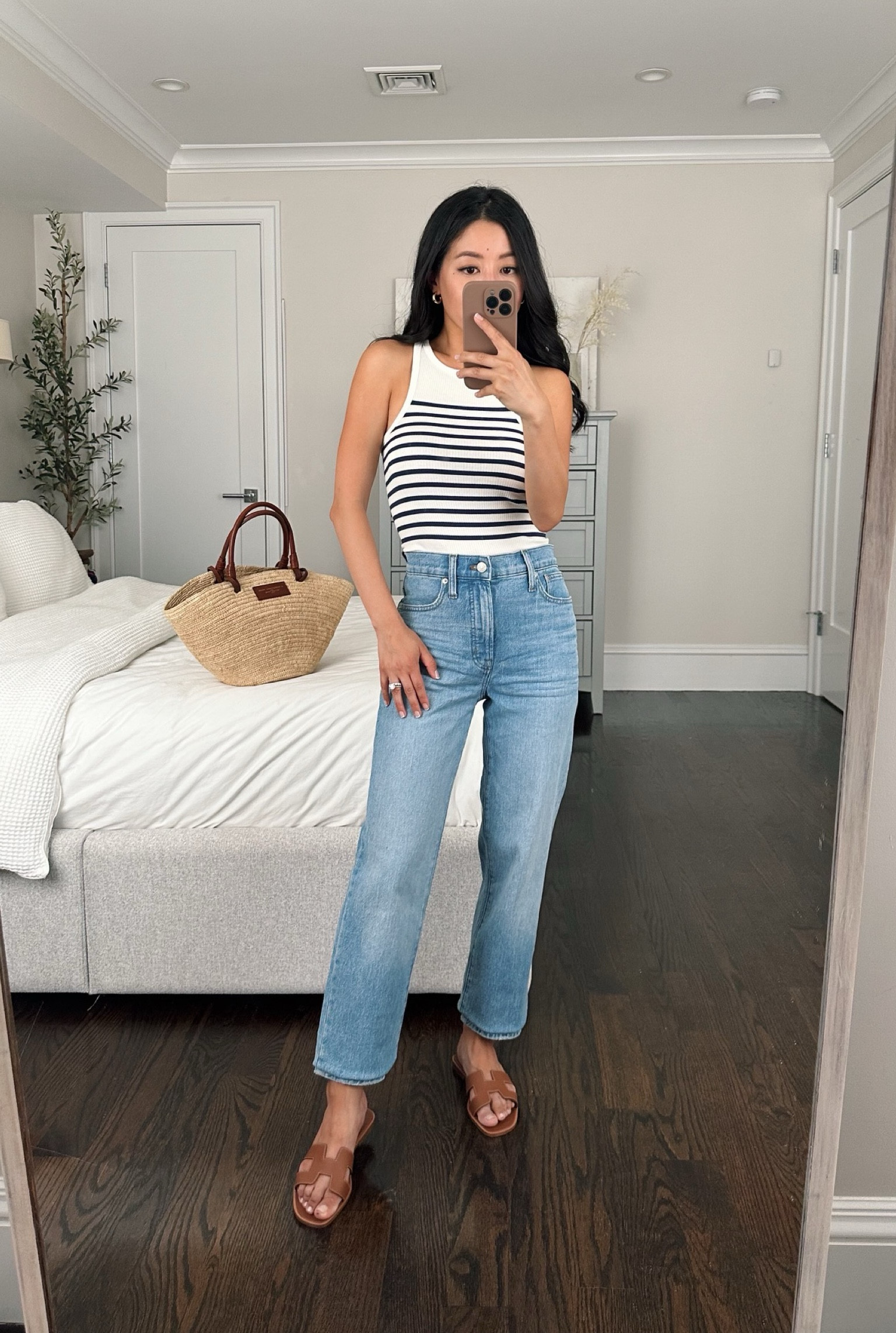 Super flattering perfect vintage straight jeans included in sale. Temporarily shortened using my DIy trick. 

• JCrew tank xxs . I Also got and love the black with white trim one linked!

•Madewell jeans - size down from your usual size (I’m wearing a 23). I ordered regular length because petite was sold out at the time, so I’m using my temporary hemming hack to fold the extra length under, might cut the hems to raw cut. 

•Sezane basket bag 

•Hermes sandals 35.5 (similar pair linked) 

#petite medium blue jeans summer casual outfit 

#LTKSeasonal #LTKstyletip #LTKFind