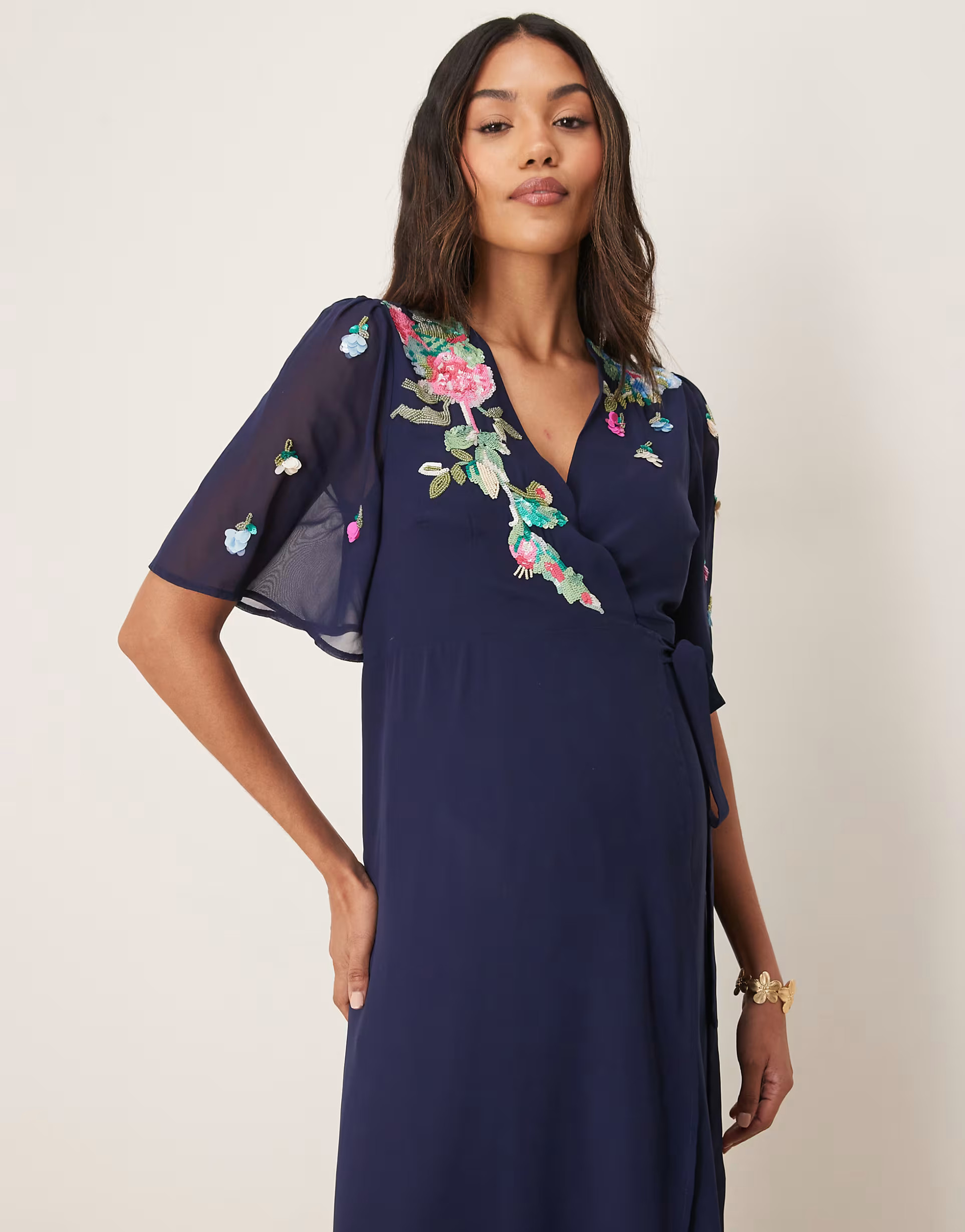 Hope & Ivy Maternity embellished flutter sleeve maxi wrap dress with tie waist in navy | ASOS (Global)