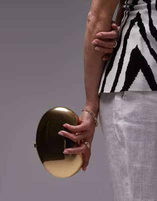 Mango oval metal clutch bag in gold | ASOS (Global)