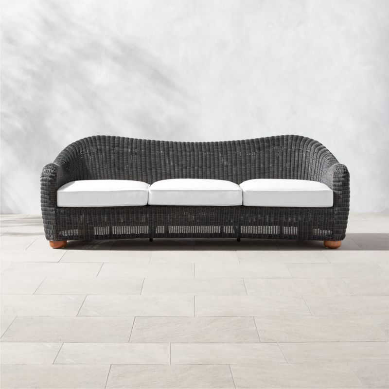 Bacio Charcoal Grey All-Weather Rattan Outdoor Sofa with White Sunbrella Cushions by Ross Cassidy... | CB2