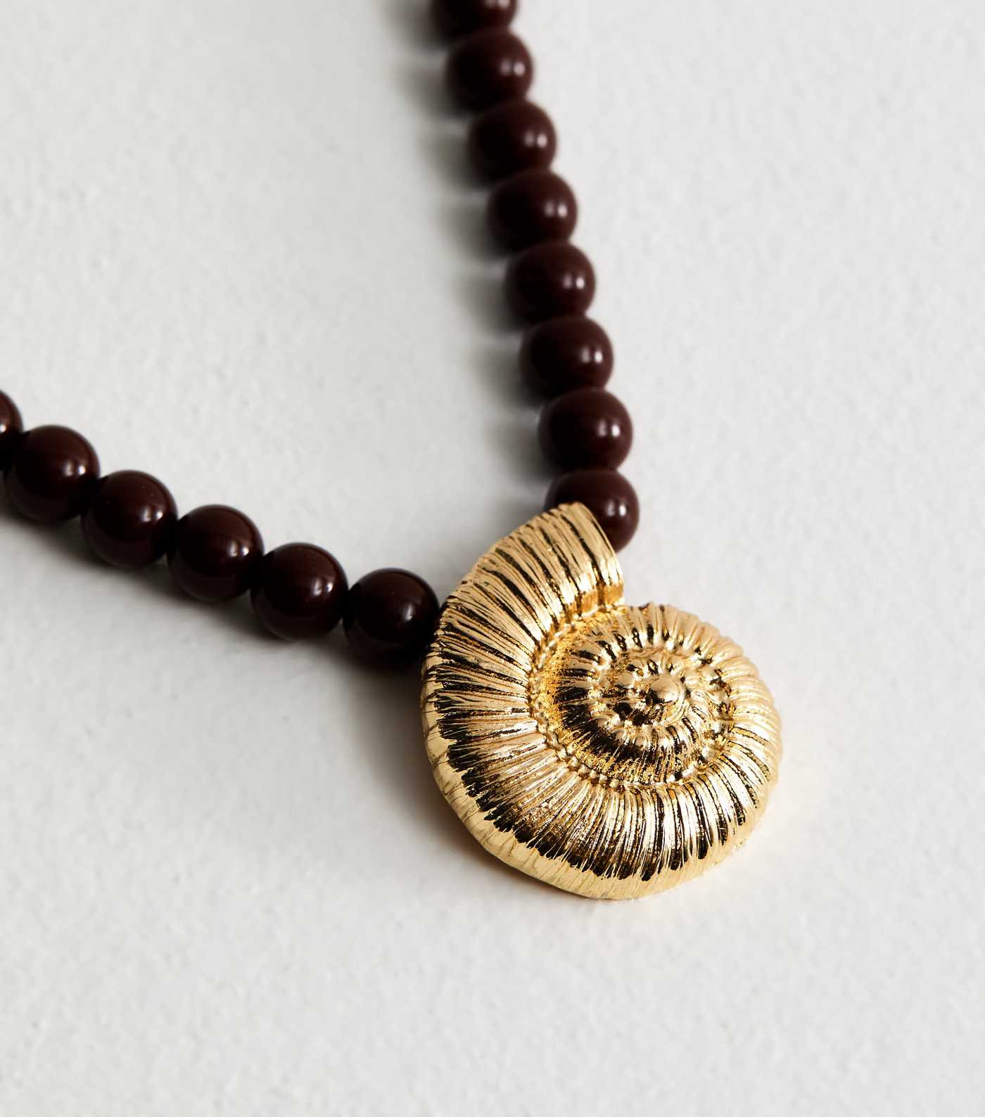 Brown Beaded Swirly Shell Pendant Necklace | New Look | New Look (UK)
