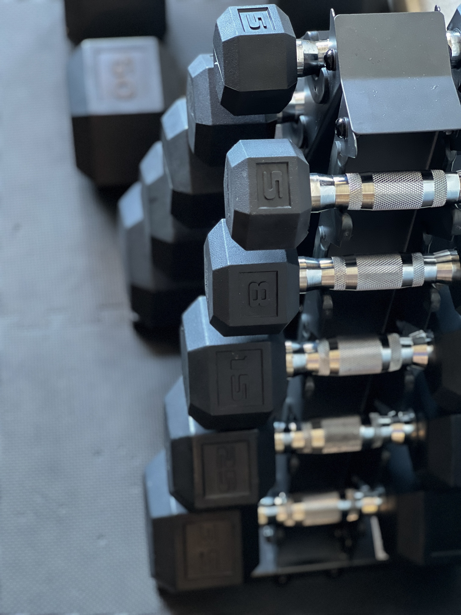 Slowly building my dream home gym: collecting dumbbell sets from CAP which I find to be a clean, classic look. Dumbbells 8-35 pounds sit nicely organized on an A-frame and atop foam puzzle mats to protect the floor and as well as my body for working out on. 

#LTKHome #LTKFitness #LTKActive