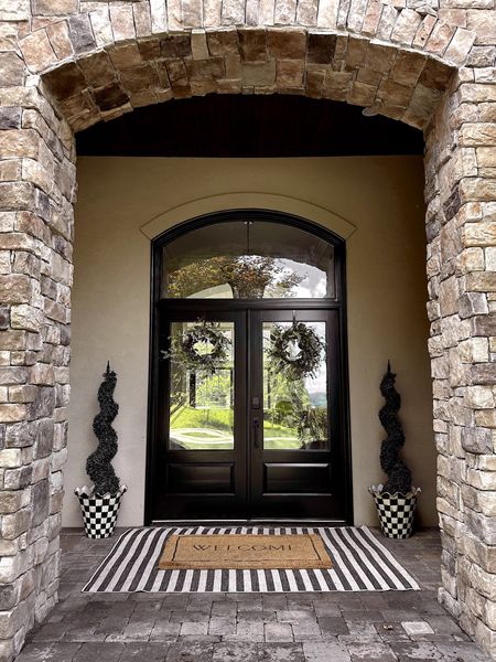 black & white stripe outdoor rug (mine is a 5x7). Linked our pots, similar faux trees, and door wreaths. 

#LTKunder50 #LTKhome #LTKstyletip