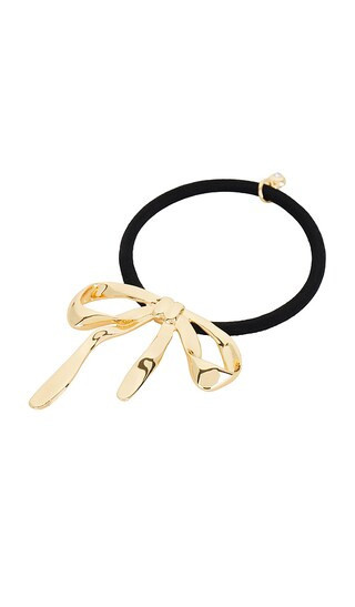 Ettika Bow Organica Hair Tie in Metallic Gold. | Revolve Clothing (Global)