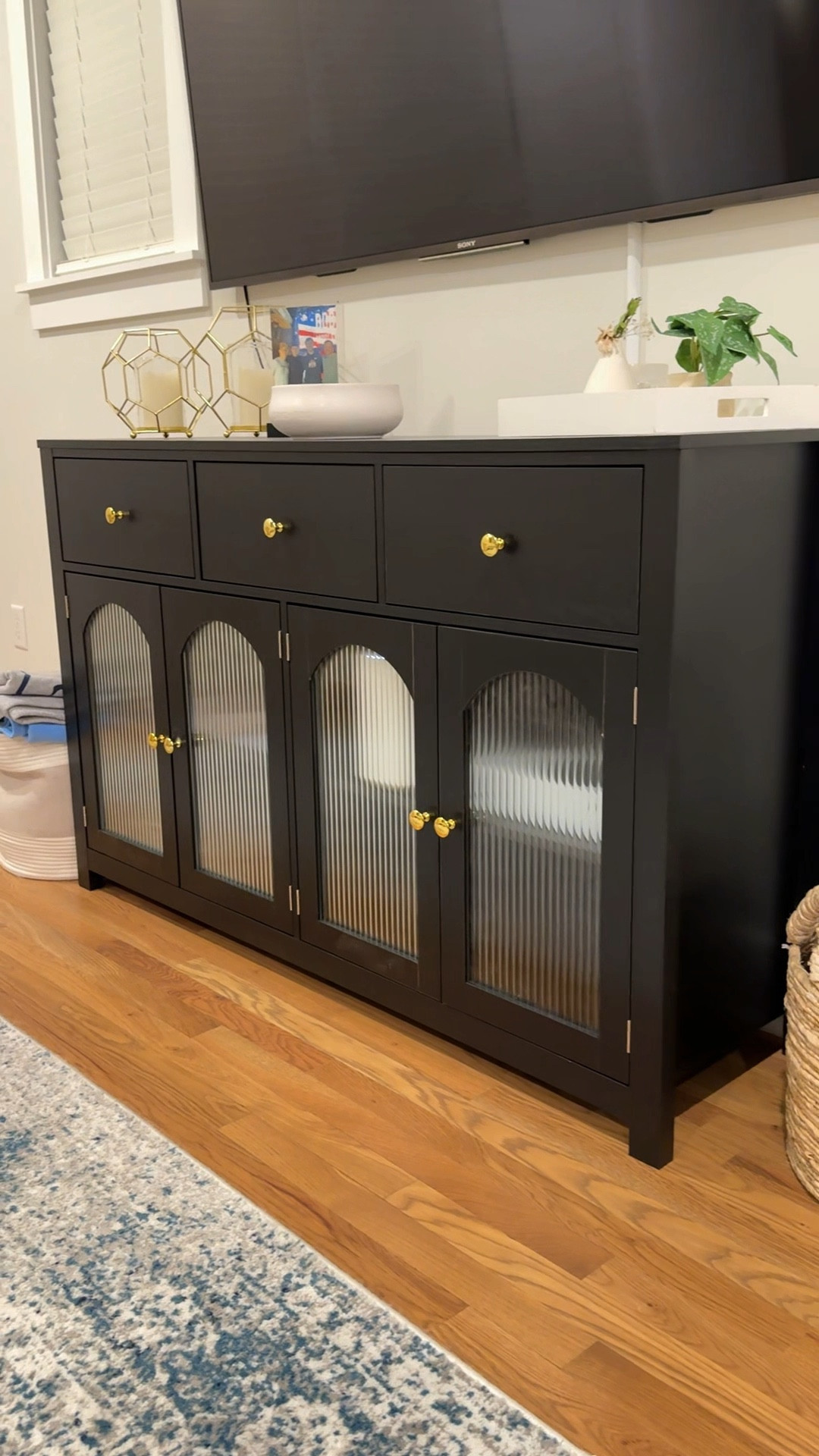 Loving this console table/tv stand from amazon! Fluted glass, adjustable shelves, three drawers and the perfect size for this space! Great quality and has gold hardware. 
Less than $200, and less than $150 right now!!!

amazon, amazon home, amazon home finds, living room, living room furniture, amazon furniture, tv stand, console table, mid century modern, home finds, interior design


#LTKHome #LTKxPrimeDay #LTKVideo