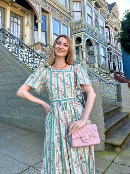 The most perfect spring dress! Romantic floral dress is blue and pink. Midi length with pockets 