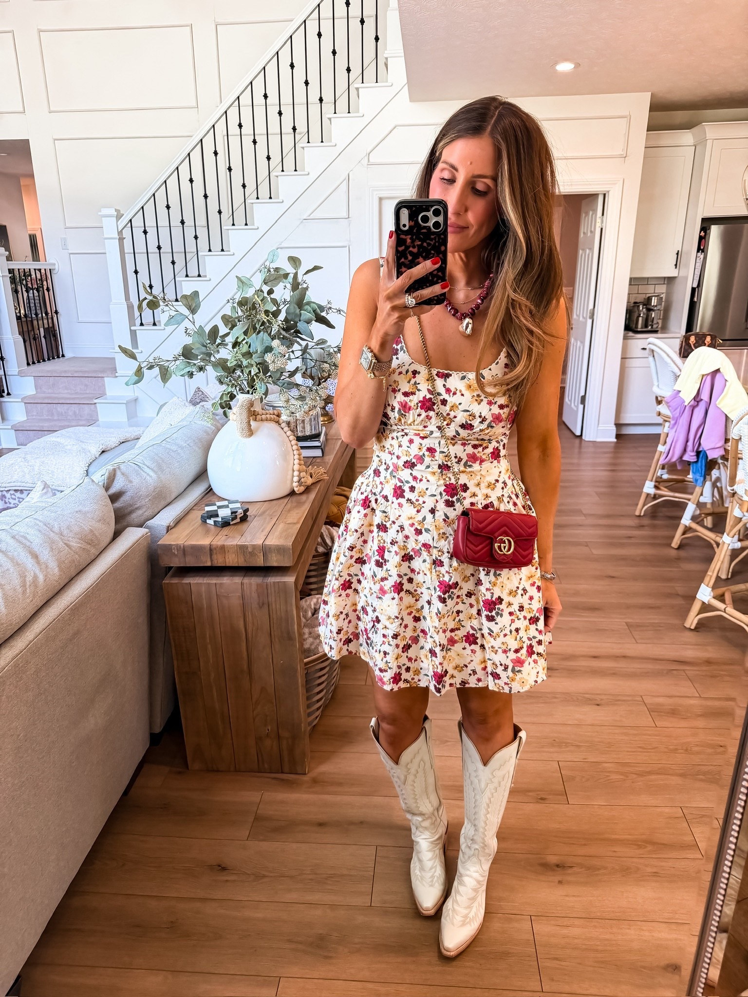 This dress + boots combo is everything right now. The floral mini keeps it soft and feminine, and the white cowboy boots give it that fun, slightly unexpected edge. Paired with the red bag and statement necklace, it feels styled without being overdone

spring outfit, floral dress, cowboy boots outfit, brunch look, feminine style, everyday chic, themominstyle 

#LTKSeasonal #LTKTravel #LTKootd