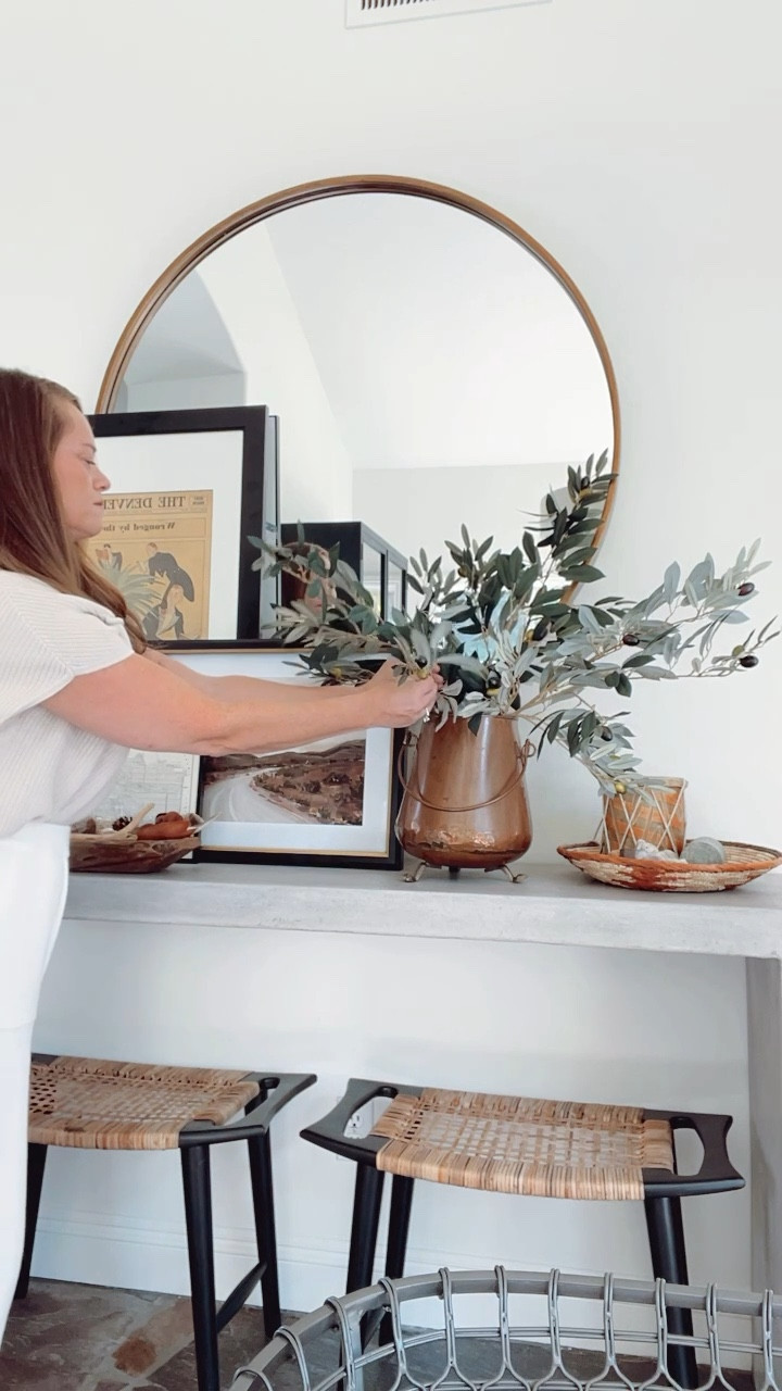 My favorite faux branches for under $12 a stem are these olive branches from Afloral. 

Tips for making your faux branches look more realistic: 
1. Always buy top quality faux branches

2. Fluff the branches

3. Don’t forget to bend the main branch itself

4. Cut the stem to fit your vase perfectly

5. Use a brown crayon to add a few dark highlights to the branch and leaves

#LTKhome #LTKstyletip #LTKfindsunder50