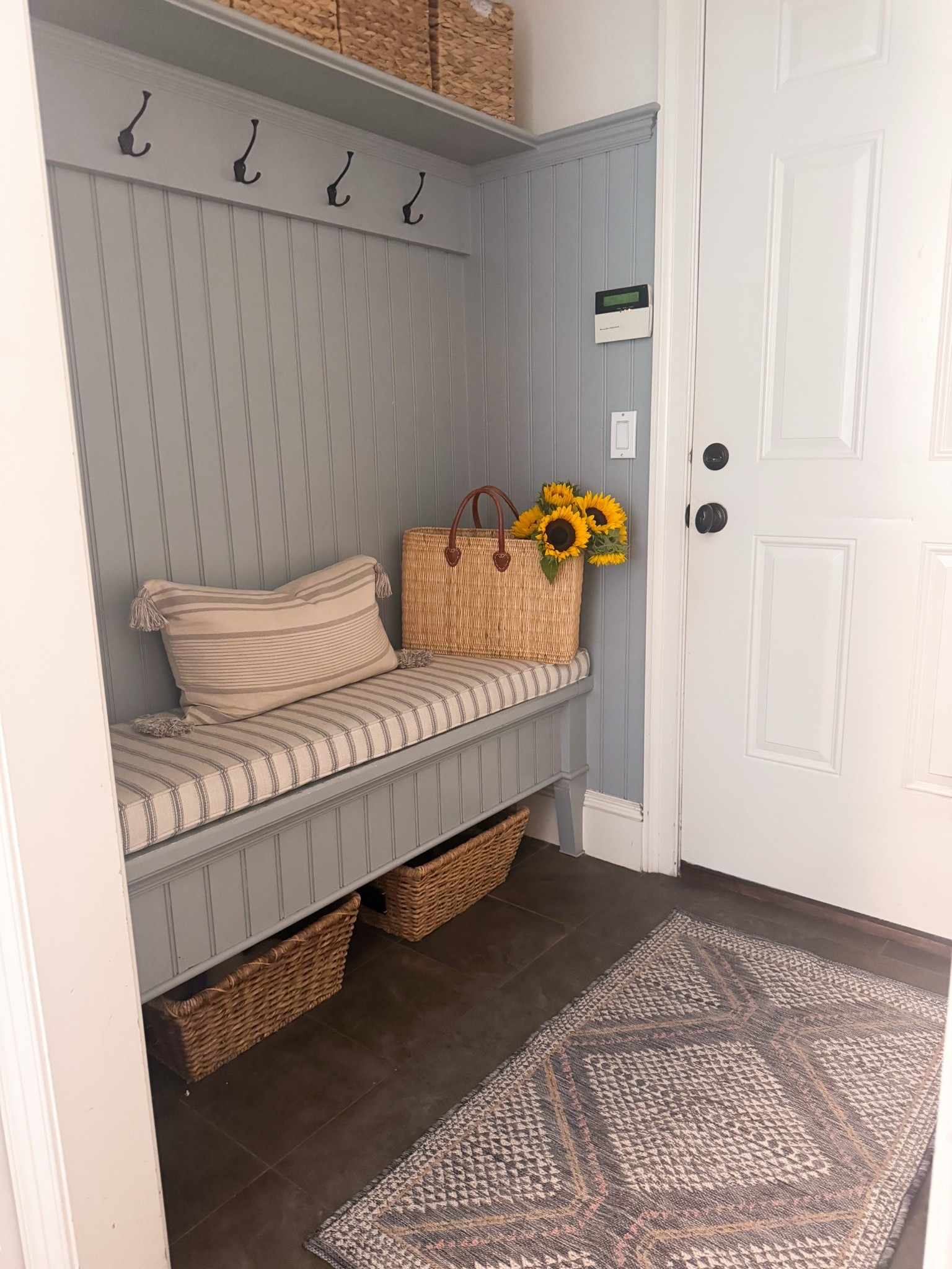 Small mudroom with custom cushion pad and rug

#LTKHome #LTKSeasonal