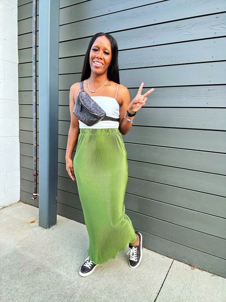 Summer outfit idea. I’m wearing a white crop top with a midi green skirt. I styled this outfit with a Calvin Klein Fanny pank and sneakers

#LTKStyleTip #LTKFindsUnder50 #LTKSeasonal