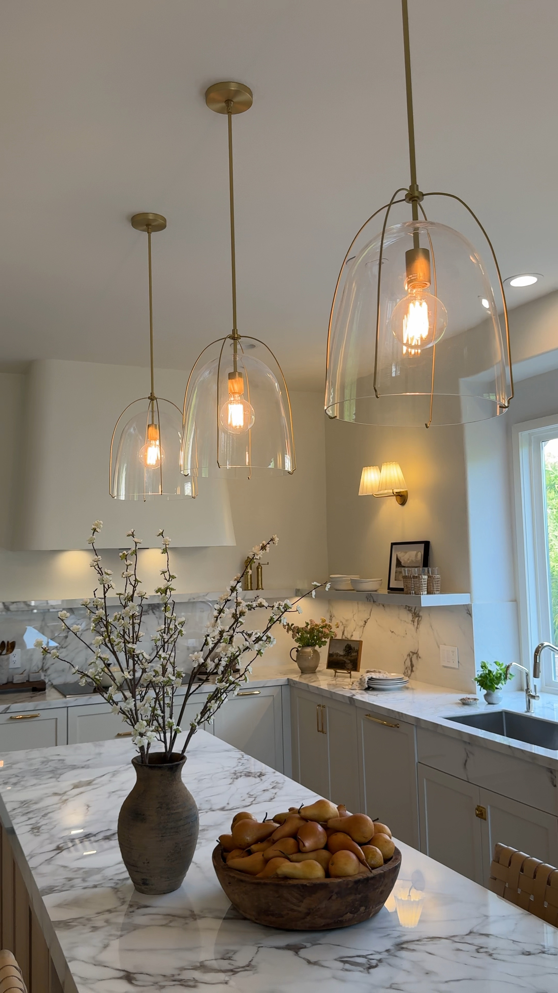 These pendant lights add the perfect amount of jewelry to this beautiful kitchen in our clients home. 

 Kitchen lighting. Favorite runner on major sale! Glass pendant, Haleigh pendant lights, brass, pendant, lights, table lamp, Brass sconces Vintage runner Amber Lewis Loloi rug brass sconce dough bowl vintage art easel plates cereal bowl glasses amazon lulu & Georgia vase brown vase Terra cotta vase 

#LTKhome #LTKfindsunder50 #LTKsalealert