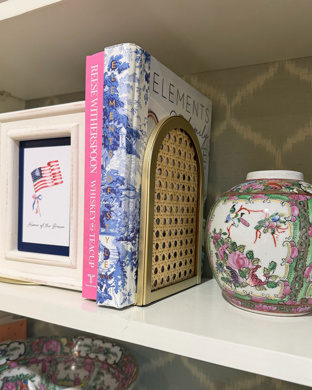 Patriotic Bookshelf Styling 🇺🇸 Grandmillennial Shelf Decor with Chinoiserie & Coffee Table Books

Adding a little patriotic charm to my bookshelf ❤️🤍💙 Styled this shelf with the prettiest gold + rattan bookends, colorful coffee table books, chinoiserie accents, and a sweet “Home of the Brave” print for a classic grandmillennial look ✨ I love mixing timeless Southern style with pops of pink, blue, and Americana decor for summer! These affordable rattan bookends are such a good find and make shelf styling feel instantly elevated 🏡🎀

Linked my bookshelf decor favorites including the gold rattan bookends, coffee table books, patriotic artwork, and chinoiserie-inspired accents ✨

bookshelf decor, grandmillennial decor, patriotic home decor, Americana decor, summer home styling, coffee table books, shelf styling ideas, chinoiserie decor, pink and green decor, Southern home decor, preppy home decor, woven rattan decor, gold home accents, coastal grandmother decor, classic home styling 🇺🇸🩷💙

#LTKSeasonal #LTKHome #LTKmomlife