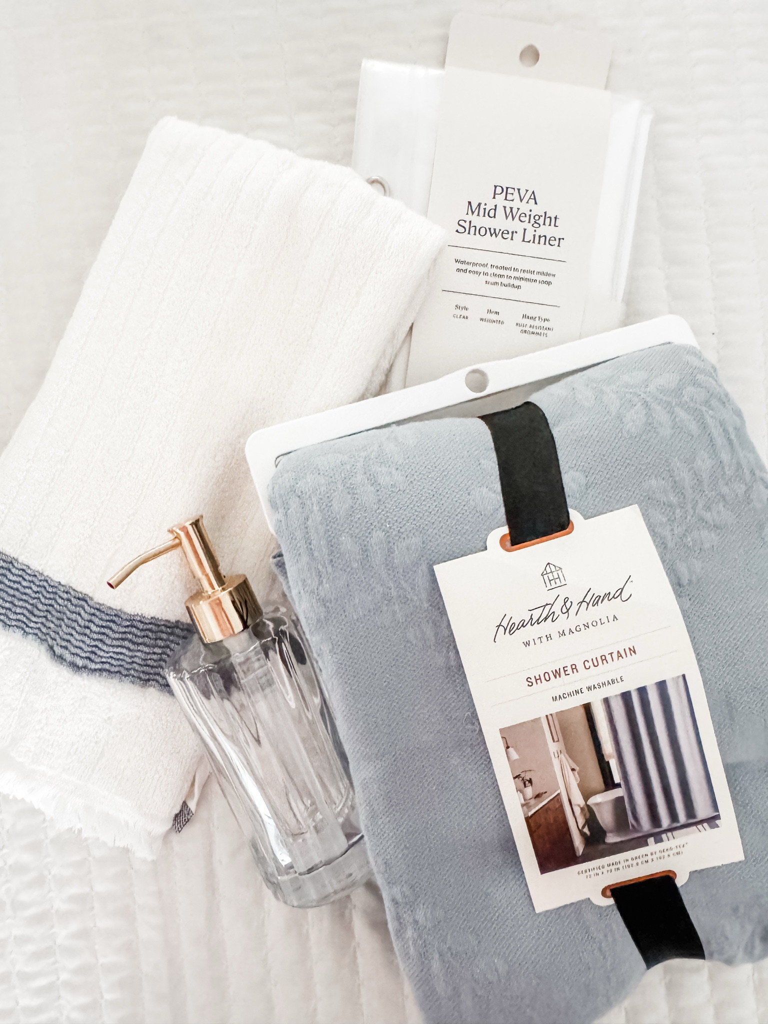 Fluted glass bathroom soap dispenser
Shower curtain
Textured stripe Terry bath hand towel
Trellis pattern shower curtain 
Blue shower curtain
Bathroom refresh
Bathroom accessories 
Shower curtain 