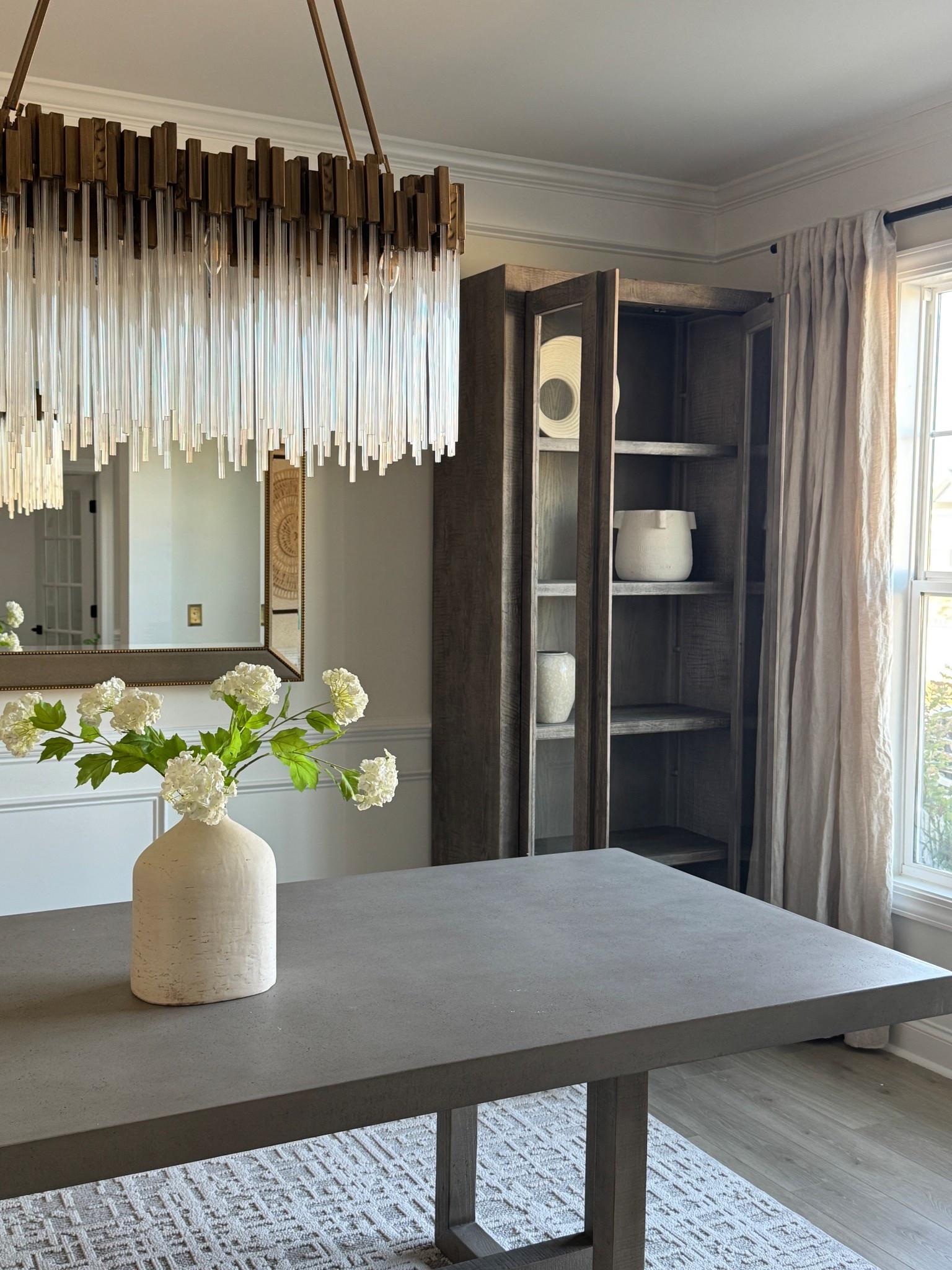 Dining room makeover! This view is everything 😍

Home decor, china cabinet, mirror, dining table, chandelier, centerpiece 

#LTKdayinmylife #LTKHome #LTKSeasonal