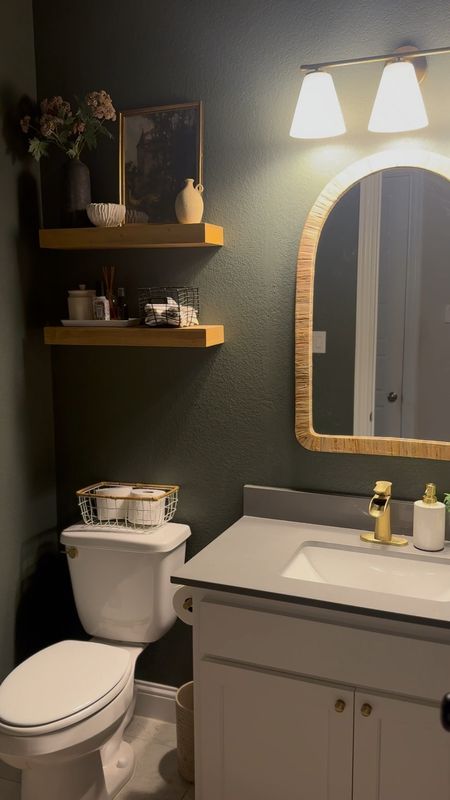 Paint color is Pewter Green by SW. 

Half bathroom decor, moody bathroom, guest bathroom, floating shelves 

#LTKHome