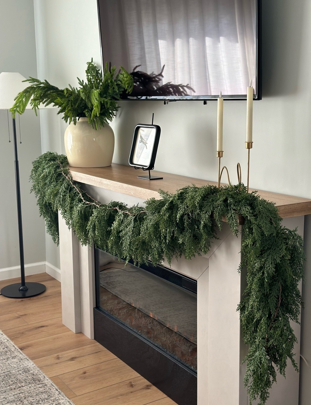 Christmas fireplace mantle. Simple garland. 

// Christmas, Christmas Decor, Christmas Decorations, Christmas Garland, Afloral

#LTKFindsUnder50 #LTKHome #LTKHoliday