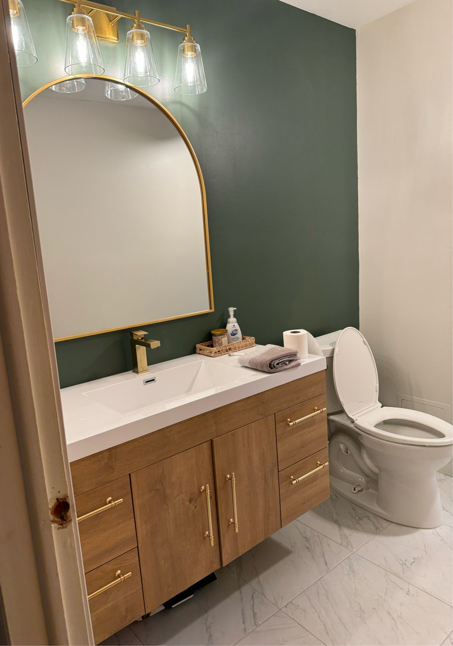 Bathroom remodel - still a work in progress but I’ve attached the faucet, mirror and lights 

#LTKSummerSales #LTKHome #LTKFindsUnder100